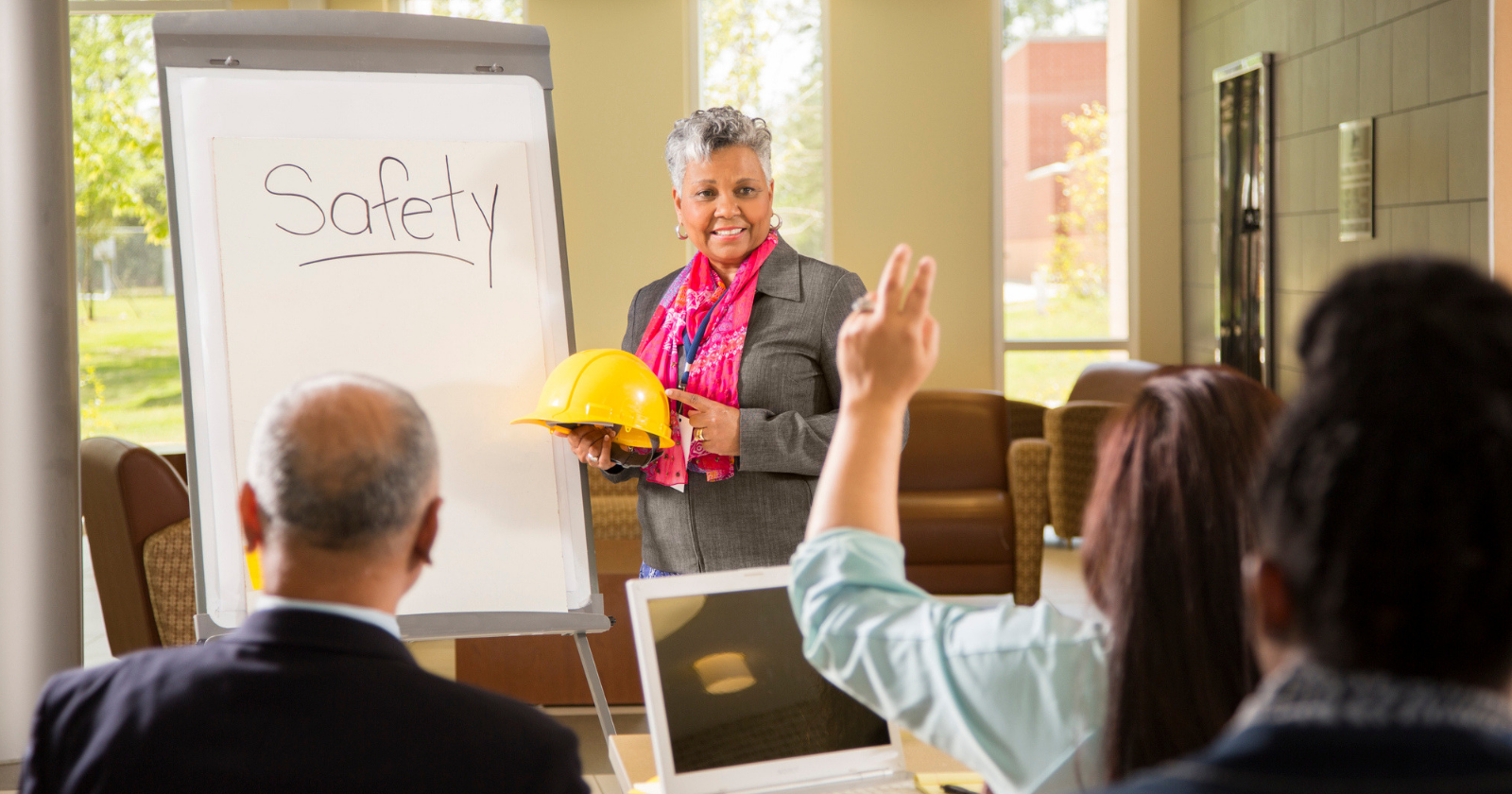 Woman teaching safety lesson in a workplace